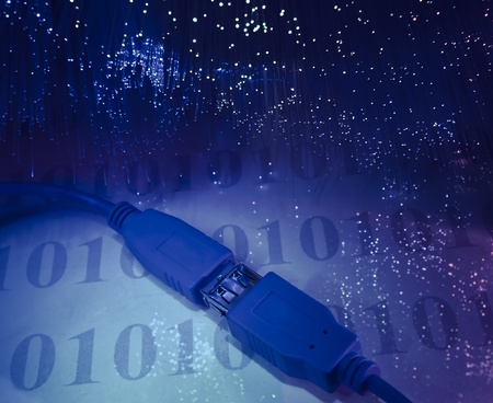 USB plugs closeup with fiber optical backgroundの写真素材