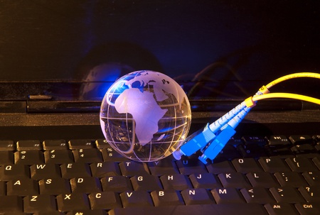 technology earth globe against fiber optic backgroundの写真素材