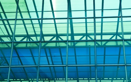 Contemporary office building blue glass wall detail の写真素材