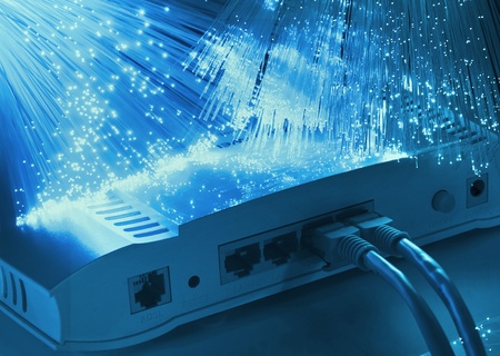 network cable and hub closeup with fiber optical background