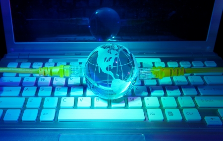 computer data concept with earth globe against fiber optic backgroundの写真素材