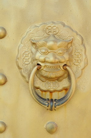 traditional chinese temple with guardian door knockersの写真素材