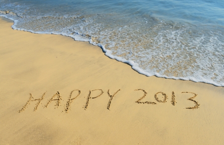 New year background with 2013 drawn in the sand