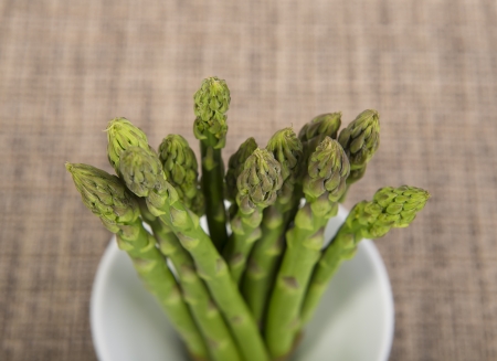 Asparagus in bowl on a black backgroundの写真素材