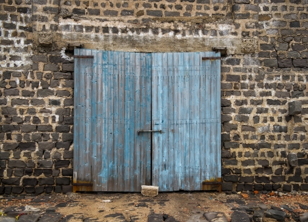 wall of ancient wooden barn with doorの写真素材