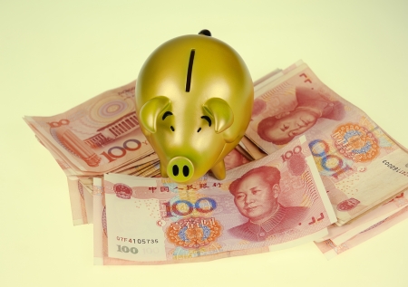 piggy bank and one-hundred rmb billの写真素材