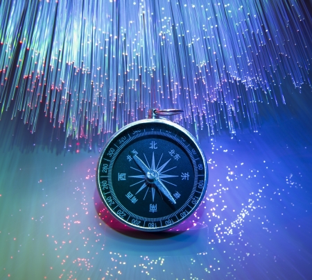 Compass on fiber optic backgroundの写真素材