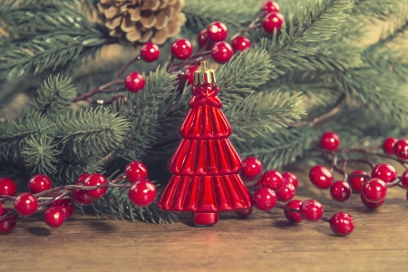 red Christmas tree on old wooden backgroundの写真素材