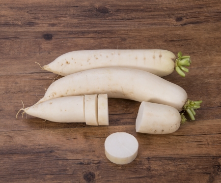 Daikon radish on the wood backgroundの写真素材