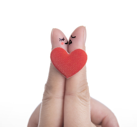 happy couple in love with painted smiley and huggingの写真素材