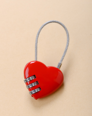 heart shape lock locked up with wood background