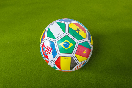  football with flags representing all countries participating in football world cup の写真素材