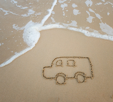 bus drawing in the sandの写真素材