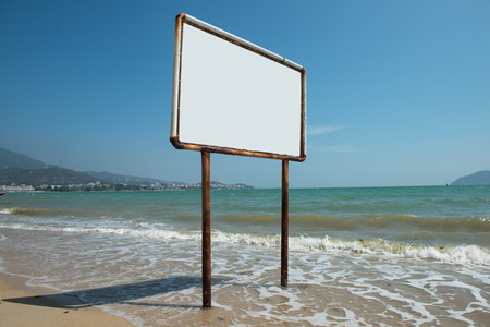 Blank sign against beautiful blue oceanの写真素材
