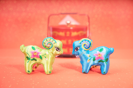 chinese goat toy on red backgroundの写真素材