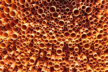 PVC pipes stacked in construction siteの写真素材