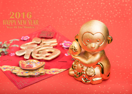 2016 is year of the monkey, Golden monkey with Chinese calligraphy "fu" : good bless for new yearの写真素材