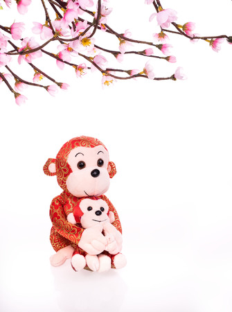 Chinese lunar new year ornaments toy of monkey on festive backgroundの写真素材