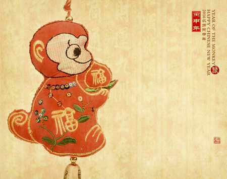 Chinese lunar new year ornaments toy of monkey on festive backgroundの写真素材