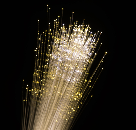 optical fibres dinamic flying from deep on technology backgroundの写真素材