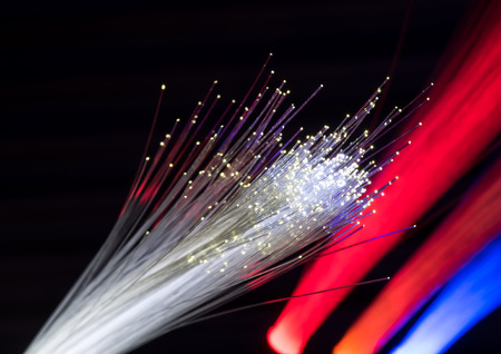 optical fibres dinamic flying from deep on technology backgroundの写真素材