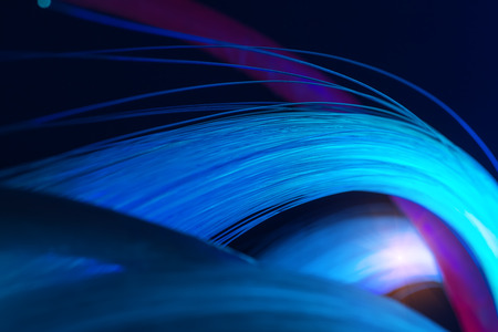optical fibres dinamic flying from deep on technology backgroundの写真素材