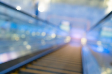 Empty escalator going down with motion blur.の写真素材