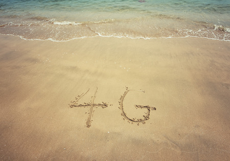 4g written in the sandの写真素材