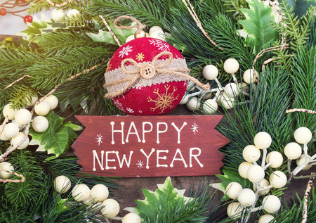 happy new year written on wooden background