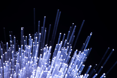 optical fibres dynamic flying from deep on technology backgroundの写真素材