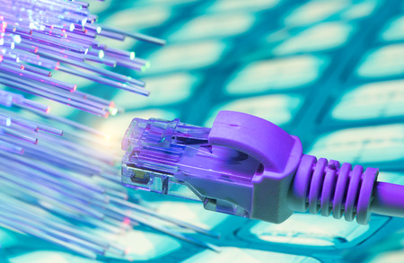 network cables closeup with fiber backgroundの写真素材