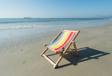 Deck chair at the tropical beachの写真素材