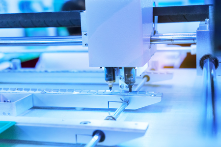 atuomatic screw feeder in cell phone assembly equipment factory.の写真素材