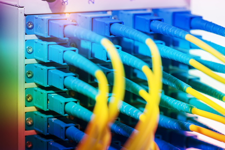 fiber optic telecommunication cables on blur background