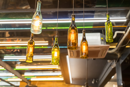 Decorative beer bottle style diode light bulb hang from ceilingの写真素材