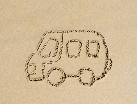 bus drawing in the sandの写真素材
