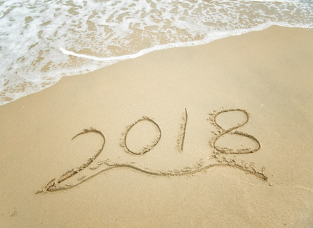 2018 written in sand write on tropical beachの写真素材