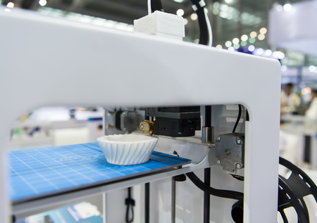 Modern 3D printer printing figure close-up macroの写真素材
