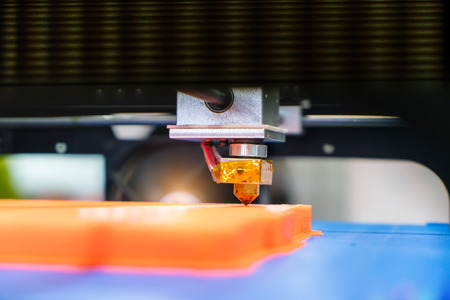 Modern 3D printer printing figure close-up macroの写真素材