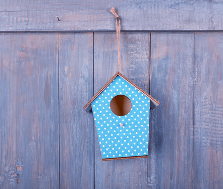 birdhouse on antique rustic wood background.の写真素材