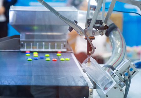 robot with vacuum suckers with conveyor in manufacture factory,Smart factory industry conceptの写真素材