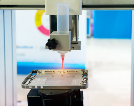 Robot holding glue syringe Injectionの写真素材