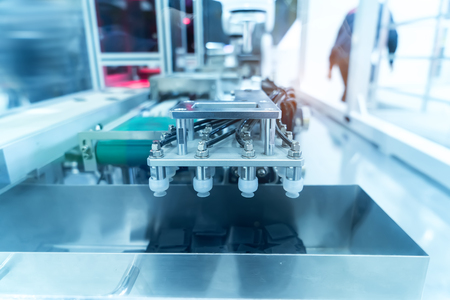 robotic pneumatic piston sucker unit on industrial machine,automation compressed air factory productionの写真素材