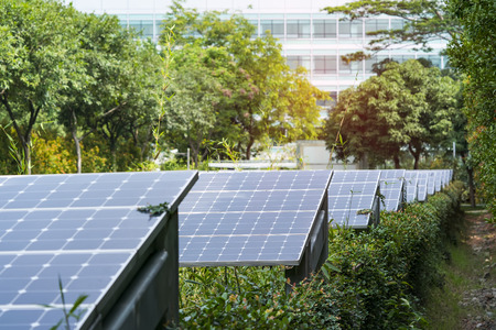 Ecological energy renewable solar panel plant with urban landscape landmarks
