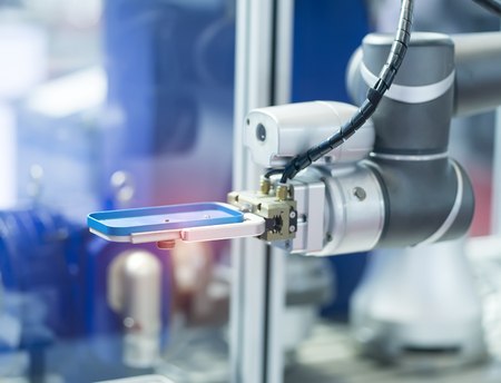 robot arm working in phone factory