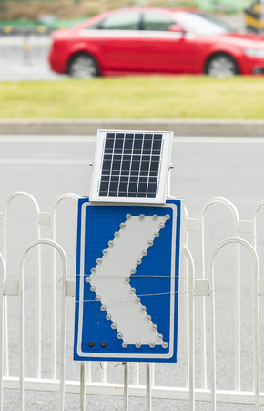 street sign with solar panel for lightingの写真素材