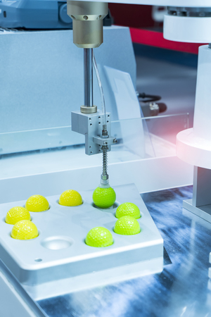 Industrail Robotic Arm use with vacuum system for holding golf sphere package, Industrial 4.0 technology for modern factory management.の写真素材