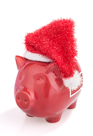 santa pig with christmas hat,piggy bank Isolated on white backgroundの写真素材
