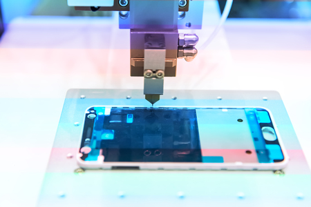 robotic machine measure the aluminum mobile phone part .