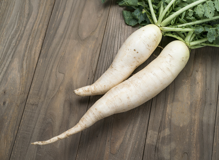 Daikon radish on the wood backgroundの写真素材